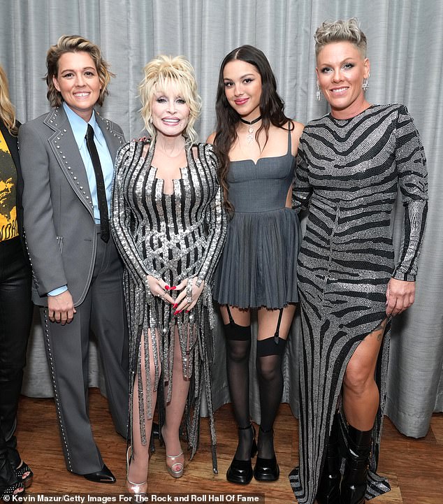 Girl power: Parton previously revealed on The View that she, Pink (right) and Brandi Carlile (left) performed a cover of the 1965 Rolling Stones hit (I Can't Get No) Satisfaction