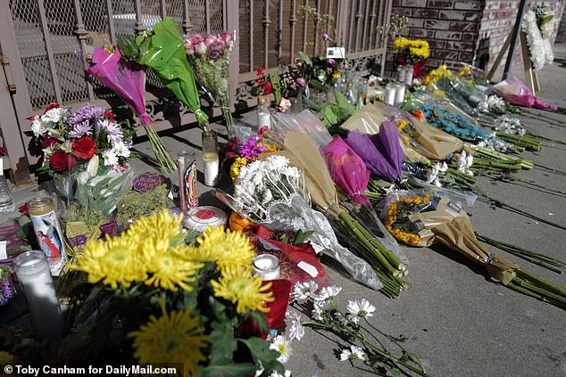 Floral tributes are piled on the site of the weekend massacre perpetrated by Huu Can Tran