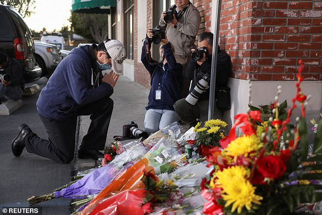 People cry outside the entrance to the Star Ballroom Dance Studio after a mass shooting during Chinese Lunar New Year celebrations in Monterey Park, California.