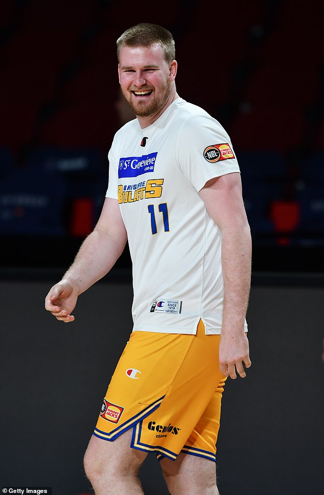 Harry Froling, pictured before a Brisbane Bullets game late last year, is facing a long recovery after suffering a fractured skull in the sickening incident.