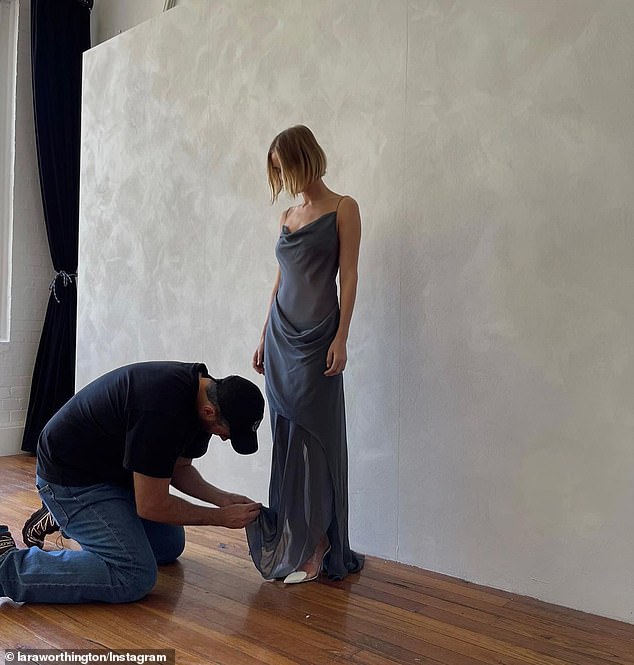 The 35-year-old model and skincare entrepreneur was recently in Sydney joining her husband Sam Worthington on a press trip.  During her visit, she stopped by Esber's studio to try on a floor-length dress, which she then tailored perfectly to her proportions.