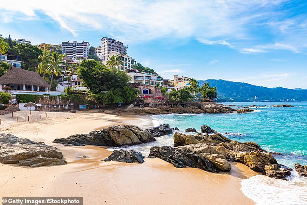 A beach like Puerto Vallarta is seen in a file photo.  Holmes had a flight booked to the luxury resort town for the end of January 2022, but says he only planned to go if she is cleared.