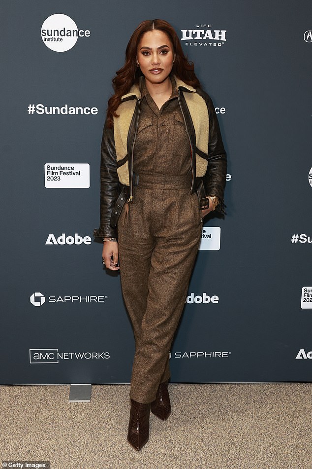 Ayesha's look: His wife of over 11 years, Ayesha Curry, opted for a brown pantsuit with a sleek brown leather coat.