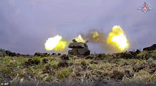 A Russian army Akatsiya self-propelled howitzer fires on Ukrainian troops at an undisclosed location.