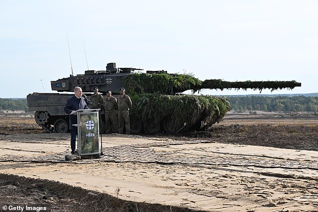 German Chancellor Olaf Scholz in front of a Leopard 2 tank in October last year (file photo)