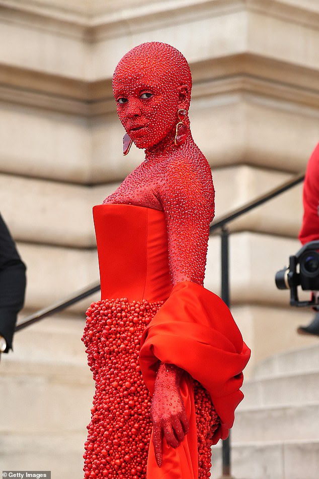 'Trigger': The singer, 27, arrived at the star-studded show on Monday and turned heads with her daring look that saw her covered in red body paint and 30,000 Swarovski crystals