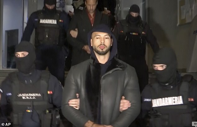 Andrew Tate is taken away by police in the Ilfov area, north of Bucharest, Romania, on Thursday, December 29, 2022.