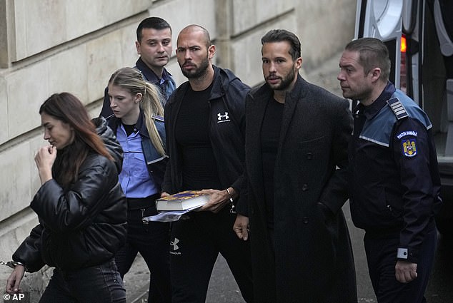 Andrew Tate (third right) and his brother Tristan (second right) are led by police officers to the Court of Appeal in Bucharest, Romania, January 10, 2023.