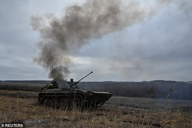 Ukrainian soldiers ride on an infantry fighting vehicle during offensive and assault drills in the southern region of Zaporizhzhia.