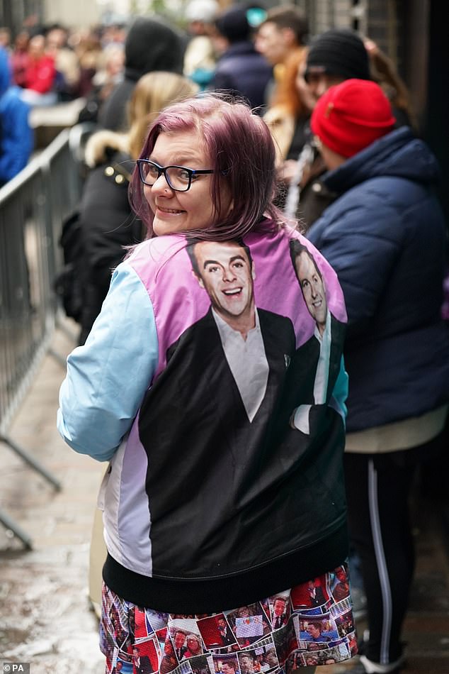 That's one way to turn heads: One delighted superfan rocked a satin bomber jacket that had Ant and Dec's faces emblazoned on the back.