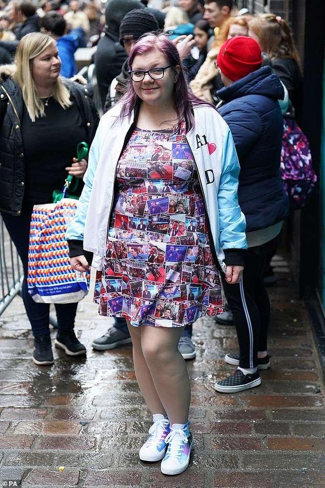 All eyes on her: She also wore a dress covered in images of the hosts as she made a flashy arrival