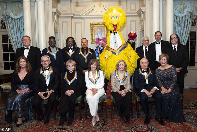 In total now: front row from left, Susan Pompeo, 2019 Kennedy Center Honorees Michael Tilson Thomas, Linda Ronstadt, Sally Field, Joan Ganz Cooney, Lloyd Morrisett, and Kennedy Center President Deborah F. Rutter, back row left to right, Secretary of State Mike Pompeo, 2019 Kennedy Center Honorees Philip Bailey, Verdine White, Ralph Johnson, characters from "Sesame Street," Abby Cadabby, Big Bird and Elmo, Kennedy Center Chairman David M. Rubenstein, Ricky Kirshner and Glenn Weiss at the Kennedy Honors in December 2019