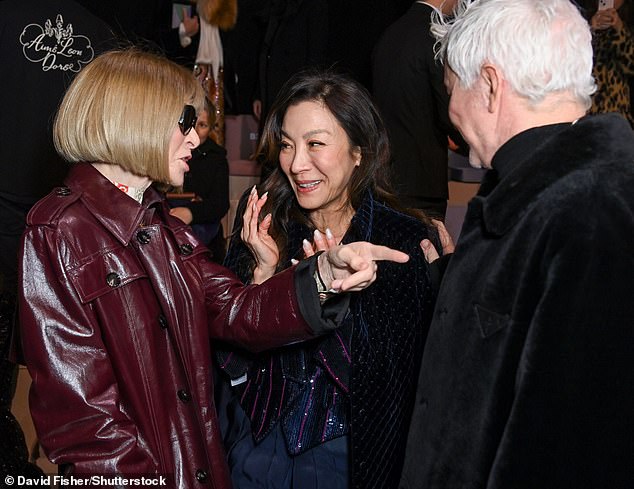 Starry!  She raised her hands to her face while chatting with fashion icon and director Baz Luhrmann.