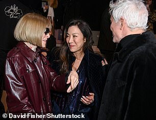 Michelle Yeoh (center) seemed amused by Ms. Wintour's joke