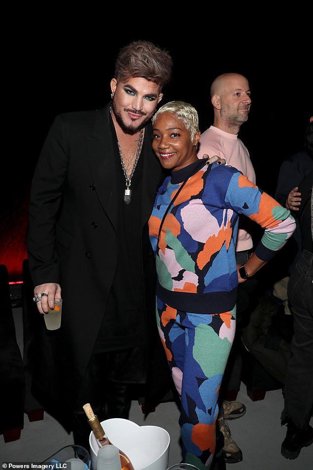 Bright look: Comedian Tiffany Haddish, 43, meanwhile, opted for a colorful ensemble and black boots and was seen mingling with singer Adam Lambert, 40, at the soiree
