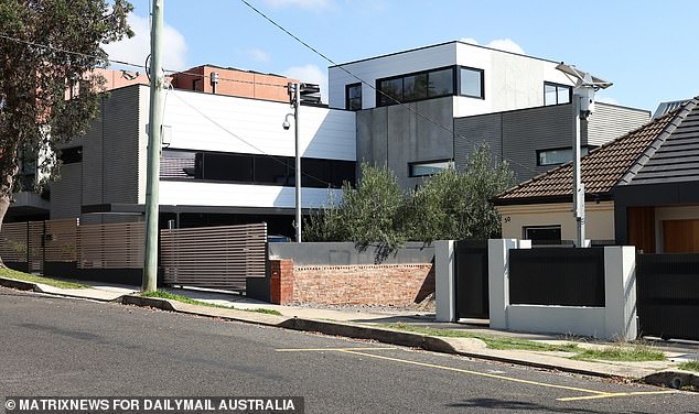 Phillip Hanslow and his wife Carole have not been living in the Maroubra house (pictured right of Guy Sebastian's imposing estate)