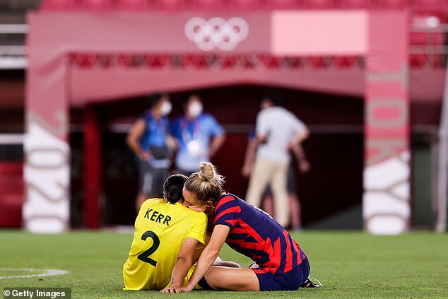 Kristie Mewis (right) comforts Sam Kerr after the Matildas suffered a devastating 4-3 loss to the USA at the Tokyo Olympics.