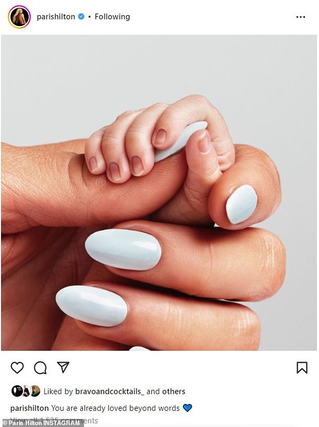 Sweet: Paris was getting back to business after revealing that she had welcomed her first child.  On Tuesday, she shared a photo of her elegantly manicured hand as her new baby gripped her thumb tightly.