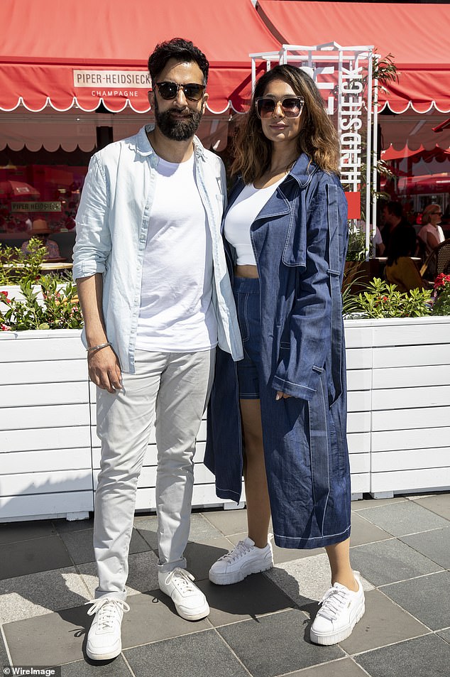 At one point, the pair hid their eyes behind some dark shades, and Dogra opted for a basic white T-shirt under an open light blue shirt and off-white pants.