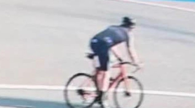 The video shows a spandex-clad cyclist driving past his luxury car and leaning over to spit at him before running off.