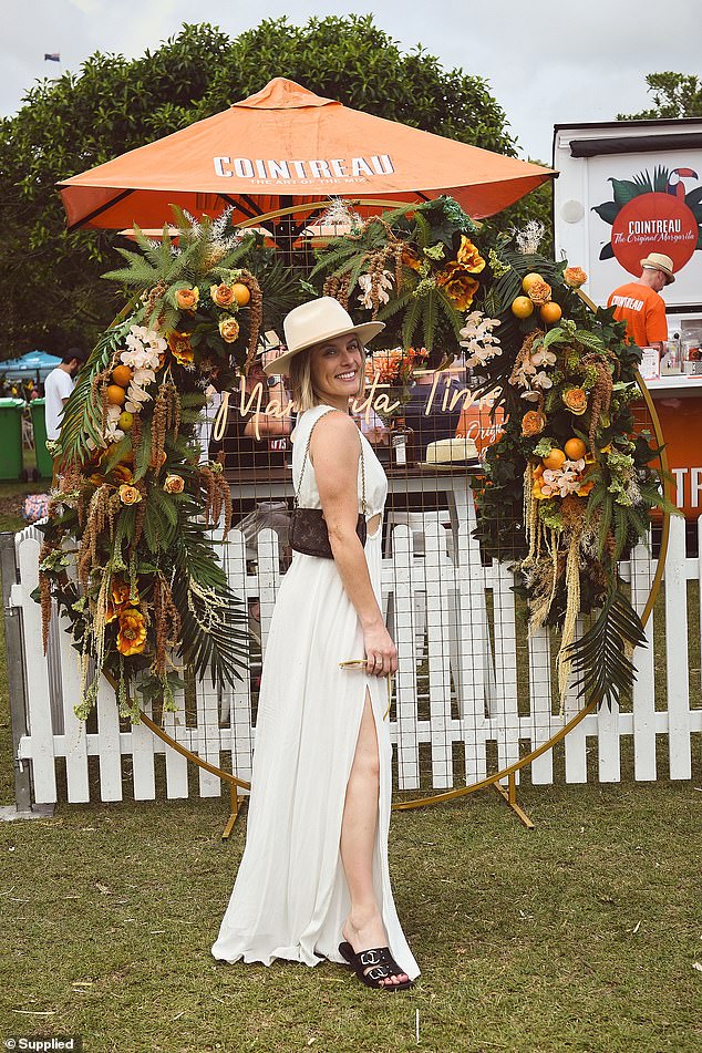 The 34-year-old former children's cheerleader looked resplendent as she posed for photos in her maxi dress, which featured multiple cutouts and thigh slits.