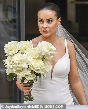 Photos obtained exclusively by Daily Mail Australia show the aspiring influencer, 28, walking down the steps of a hotel and into a waiting limousine.