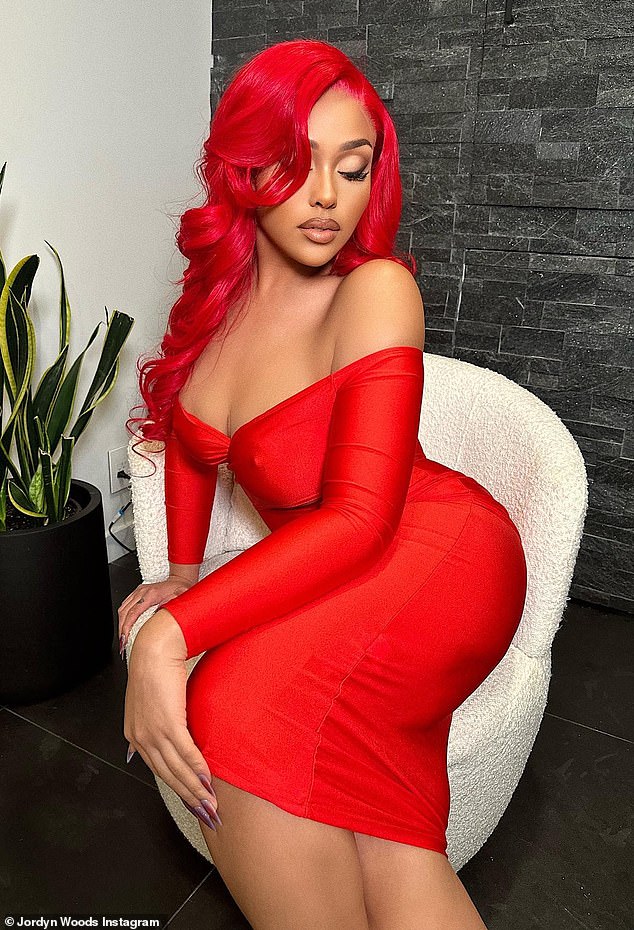 Her date night look: The influencer took to Instagram to show off her enviable curves in an off-the-shoulder red dress that matched her fiery hair while promoting the Valentine's Day look