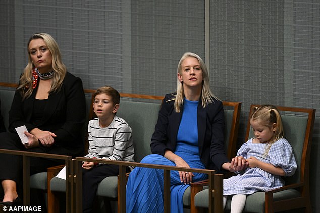 Laura Chalmer (above, second right, with children Leo and Annabel as husband Jim delivered his first budget last year) is a former staffer for Julia Gillard and Penny Wong.