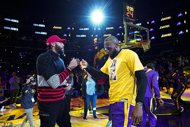 Lakers center Anthony Davis (left) will play Wednesday to take the scoring burden off James.