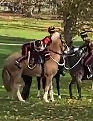 The footage shows the commander needing two soldiers to help her into the chair.