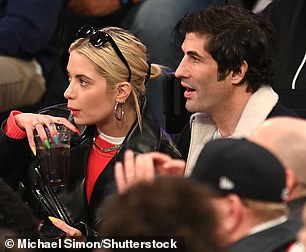 Thirsty Job: Ashely sipped a courtside soda while getting in on the action.