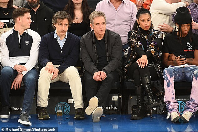 Shoulders elbow: Also in attendance at the game was film director Noah Baumbach, 53 (left)