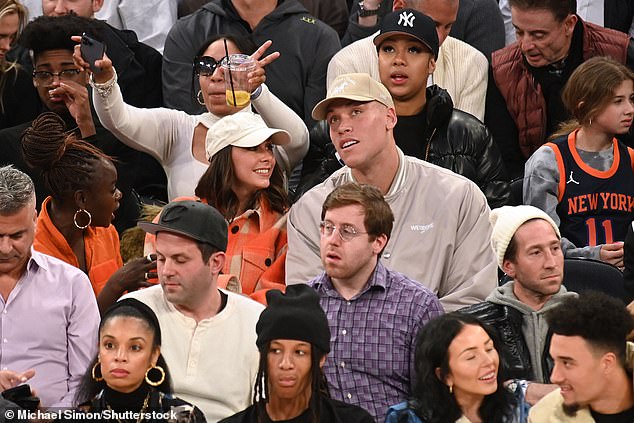 Date night: Baseball player Aaron Judge was also pictured at the game with his wife Samantha