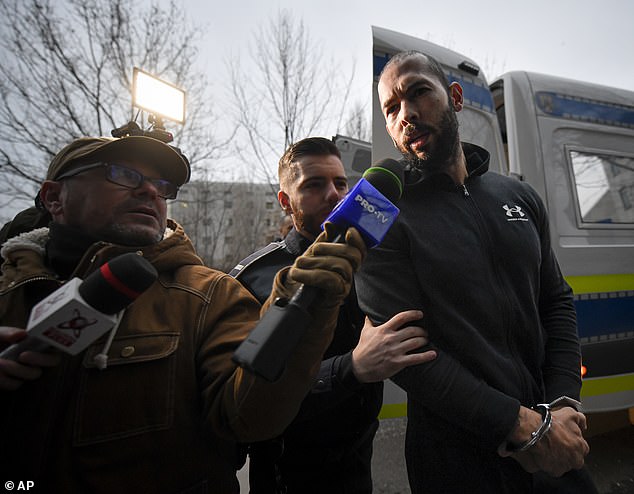 Today, Tate and Tristan, both wearing black clothes, were escorted from a police van into the Romanian Directorate for Investigating Organized Crime and Terrorism building