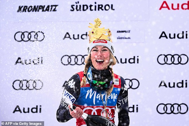 Shiffrin celebrates on the podium after winning the women's giant slalom in Italy on Tuesday