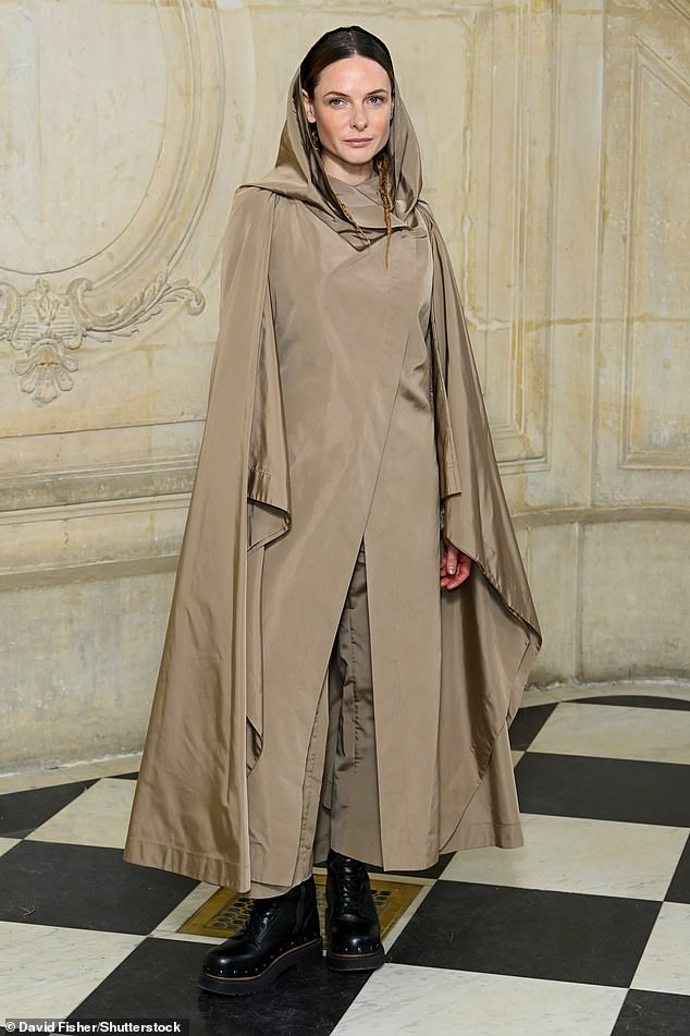 Caped Crusader!  Rebecca Ferguson opted for a bizarre beige hooded ensemble with chunky boots when she attended the Dior show.
