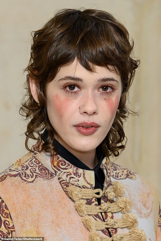 Mathilde Warnier looked like she was going to a costume party in a military-style jacket with hearts painted on her cheeks.