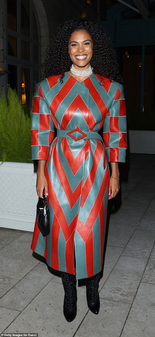 Tina Kunakey cut a striking figure in a red and green leather dress while attending a private dinner celebrating the Gucci High Jewelry Collection at the Ritz Hotel.