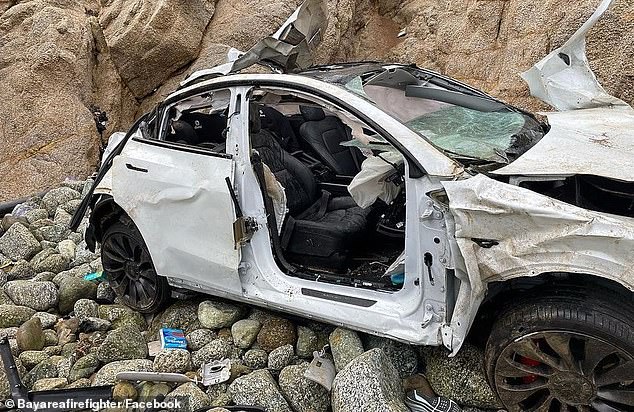 Miraculously, the family of four survived the fall to the water's edge without sustaining life-threatening injuries.  The wrecked Tesla Model Y is shown after the crash