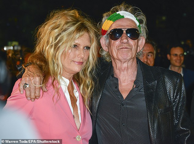 Iconic: Keith has said he likes to 'play his old lady' when it comes to his wardrobe - pictured with wife Patti Hansen in 2016