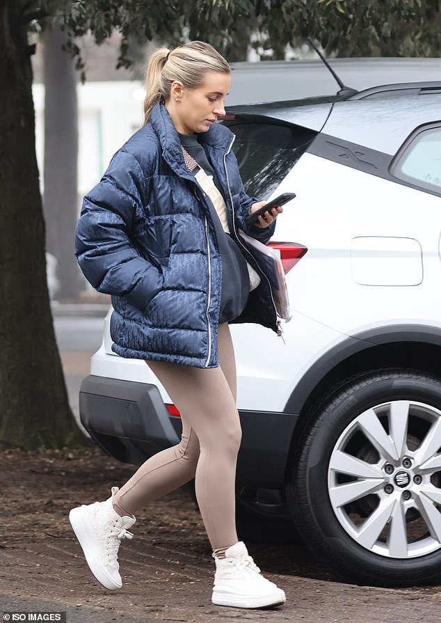 Casual: The former Love Island star, 26, who announced her pregnancy earlier this month, rocked a figure-hugging pair of beige leggings for the outing