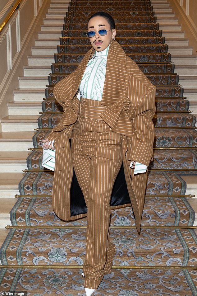 Walk This Way: Doja turned heads with her quirky androgynous look as she rocked high-waisted striped pants and a matching oversized coat that swamped her slender frame.