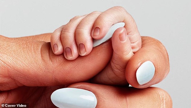 The baby is here: Paris shared this tender photo where she held her baby's hand