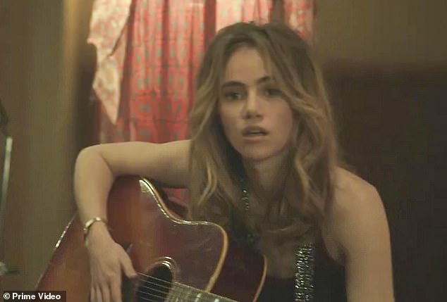 Rocking it: Suki Waterhouse is shown playing the guitar while playing Karen Sirko