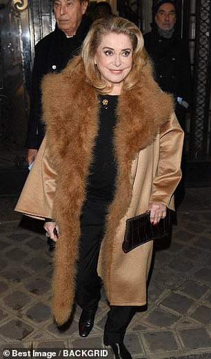 Stylish: The French actress looked stunning in a beige coat with a faux fur trim