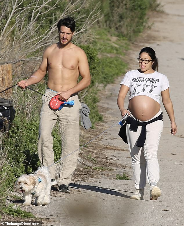 Shocking: As she prepares to give birth to her first child any day now, the actress, 38, showed off her pregnant stomach in a vintage white T-shirt, with 'Butthole Surfer' written across the chest