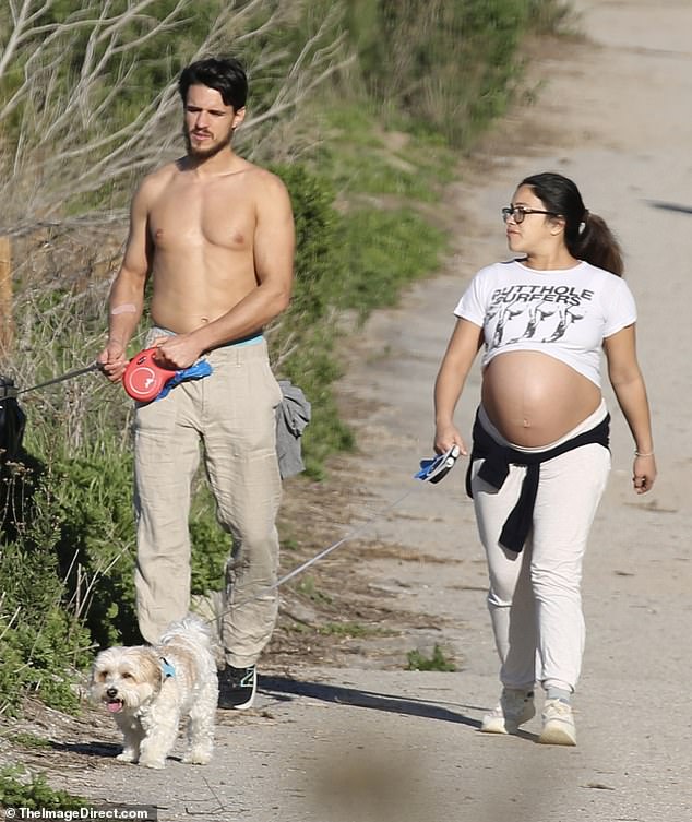 Any day now: The Jane The Virgin star, whose due date is January 16, looked ready to break out as she strolled alongside her hunky husband, who went shirtless on his latest outing.