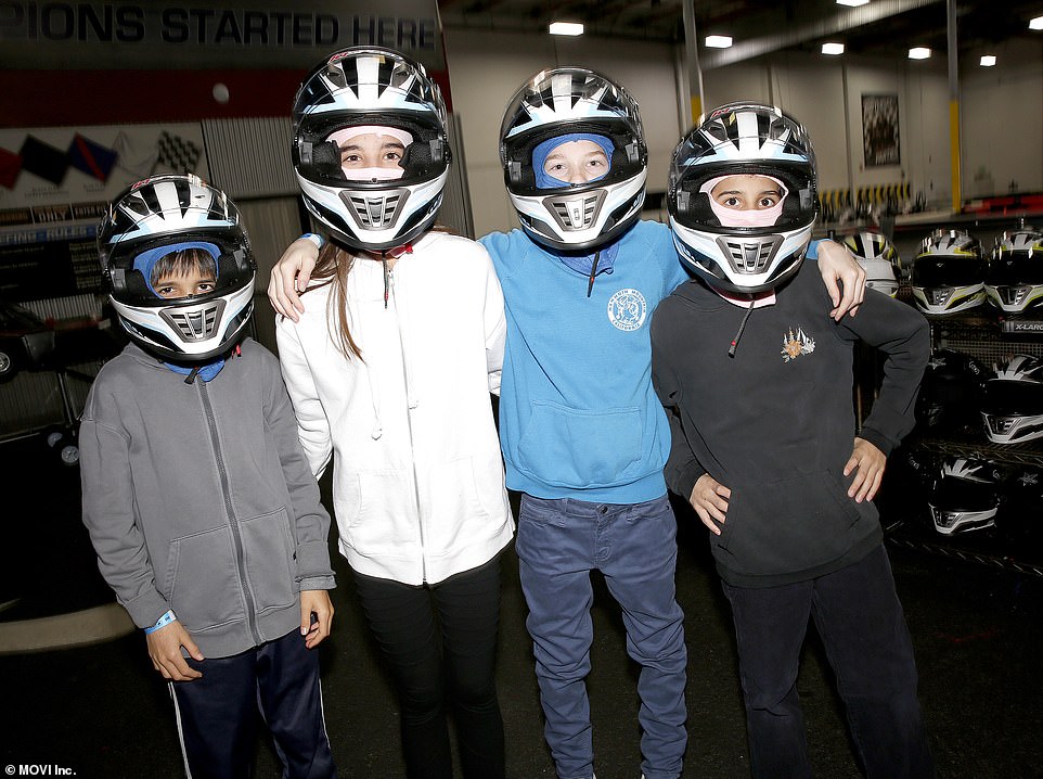 Ready to roll: four of the eight kids tried on the helmets with the eye shields up