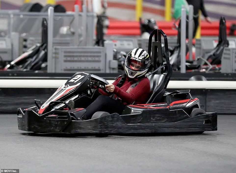 She sure can drive: Nadya is seen here spinning her go kart while wearing her helmet over her braid