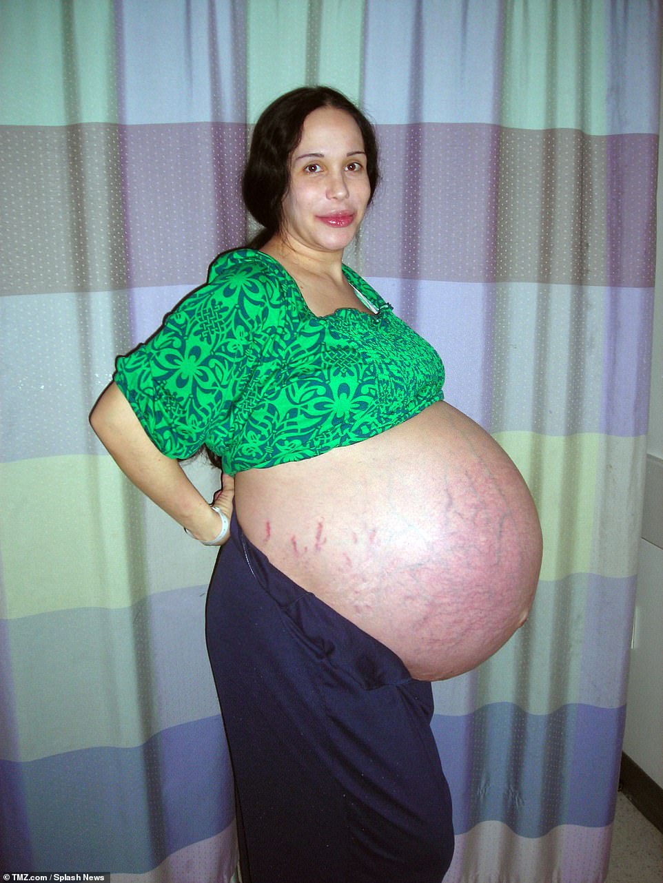 A lot to take in: This image was taken just days before she gave birth to eight children in January 2009.